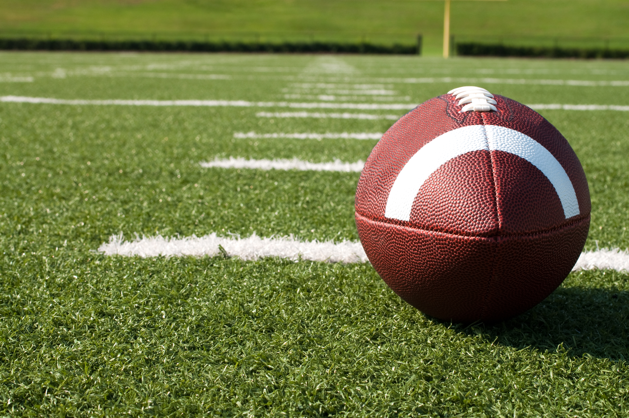 closeup of american football on field