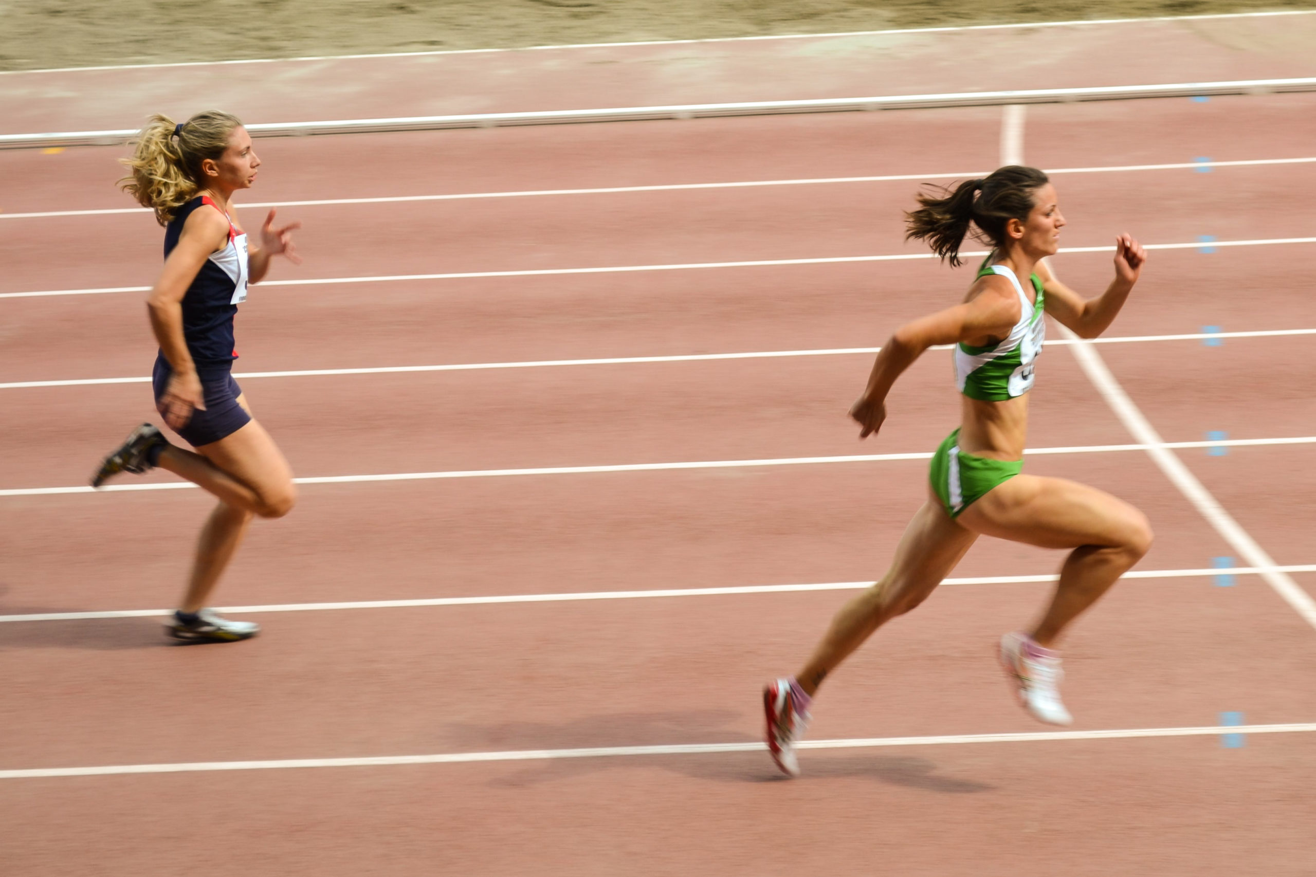 two young women running track