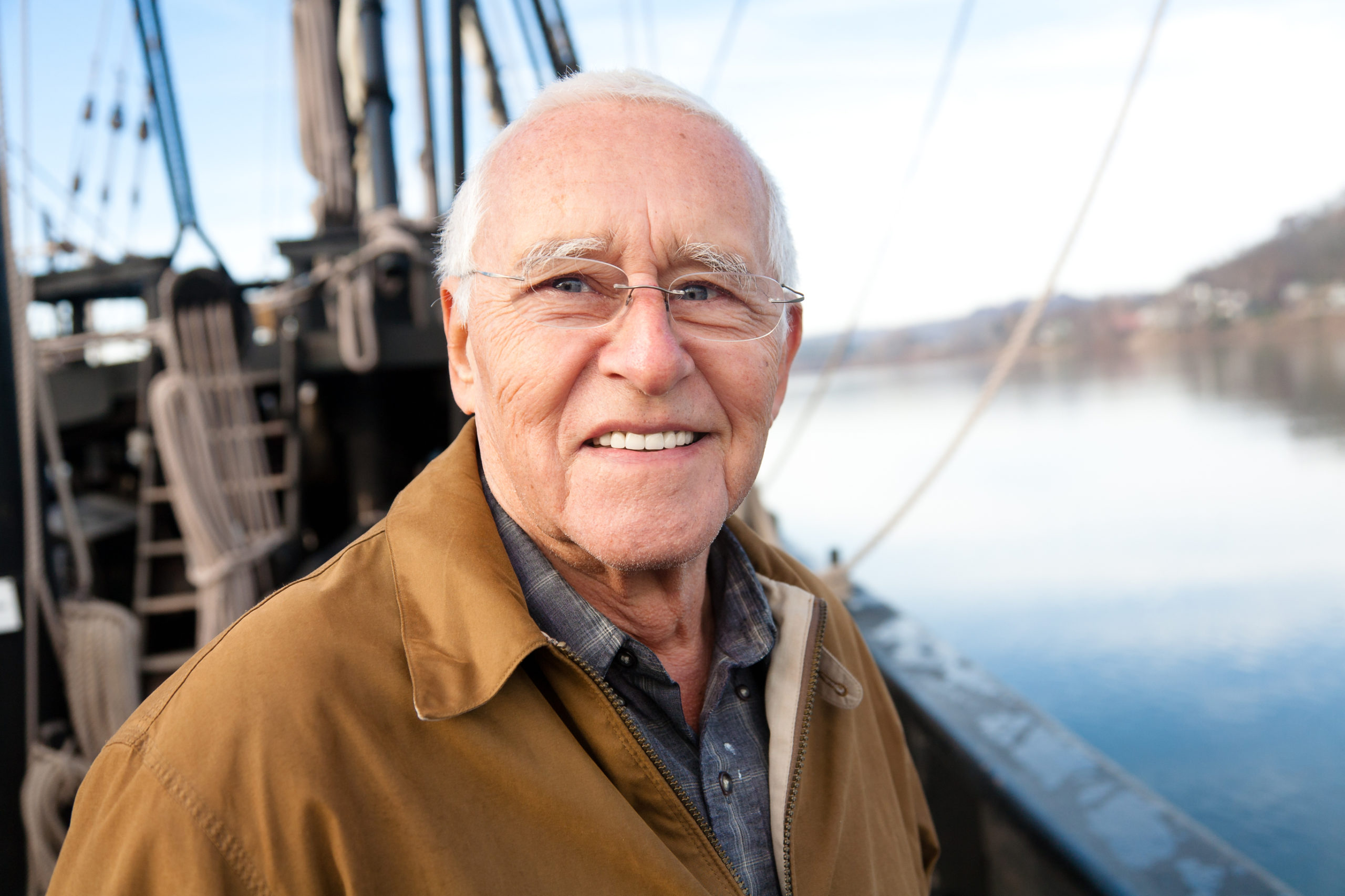 senior man on a ship smiling
