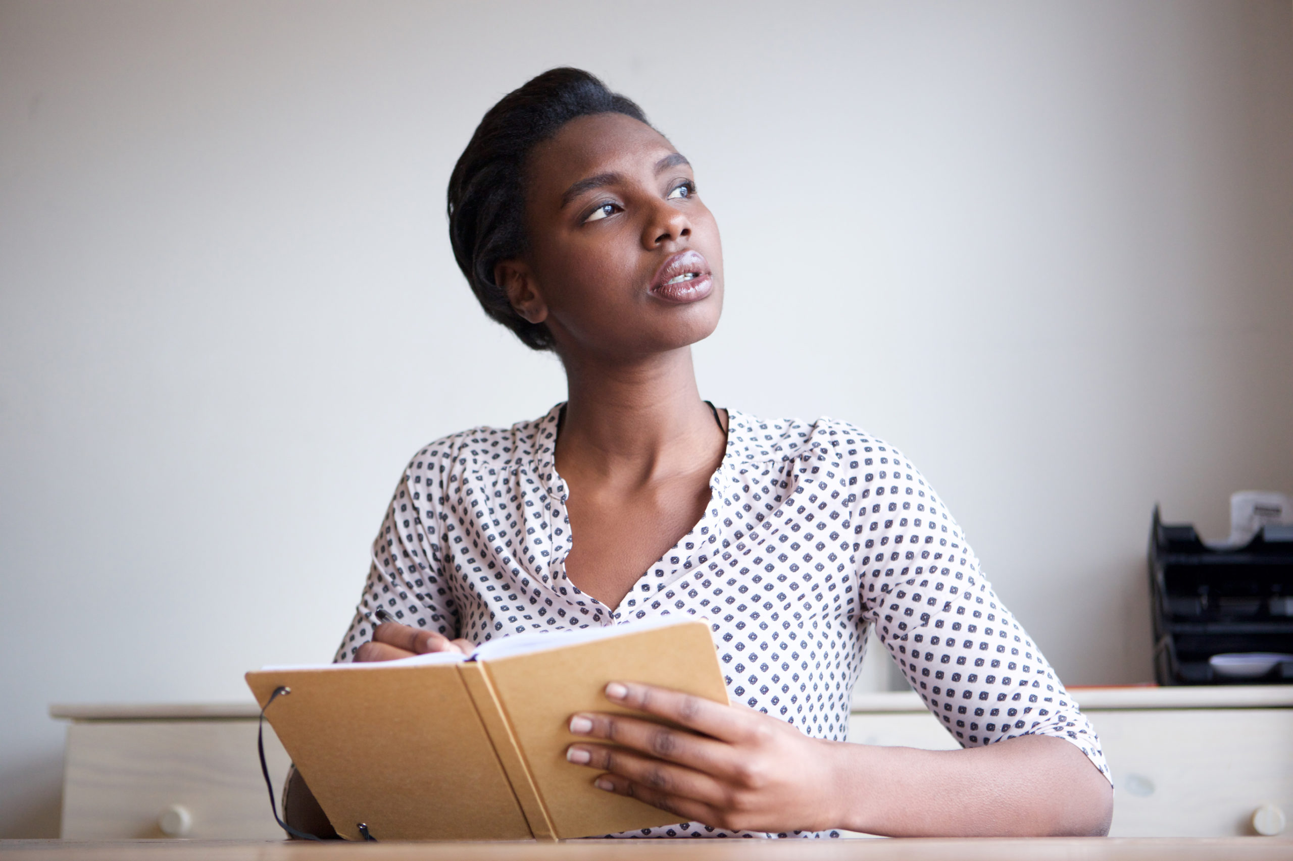 woman looking up contemplating something