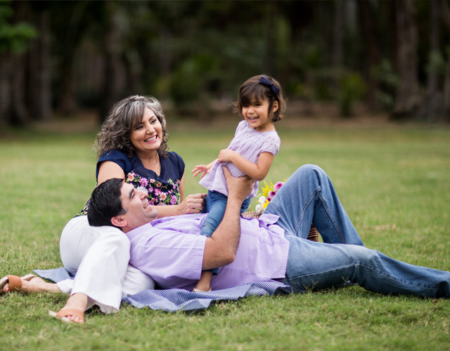happy family lying down in the park