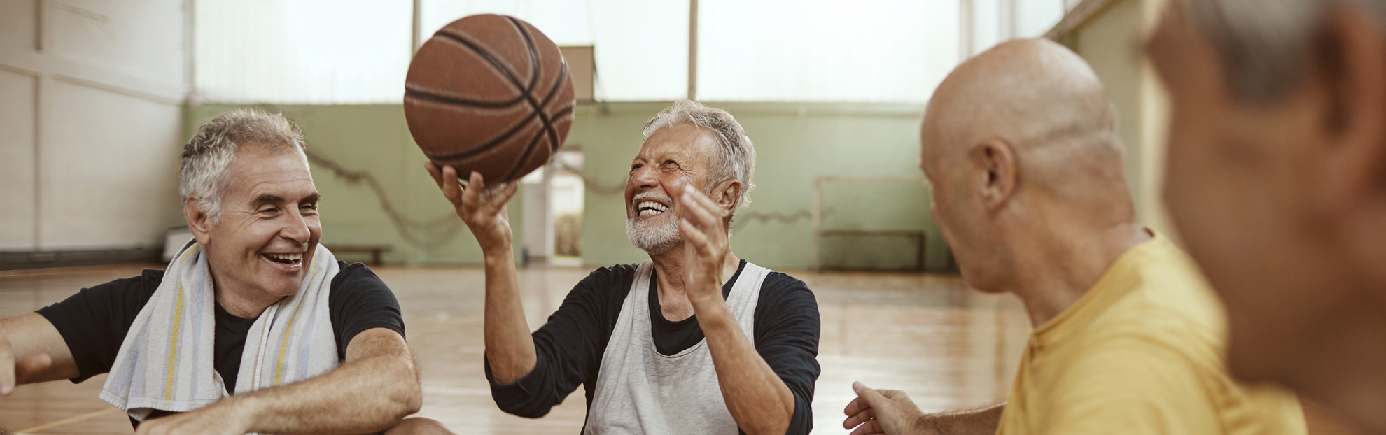 Male cataract surgery patients playing with basketball