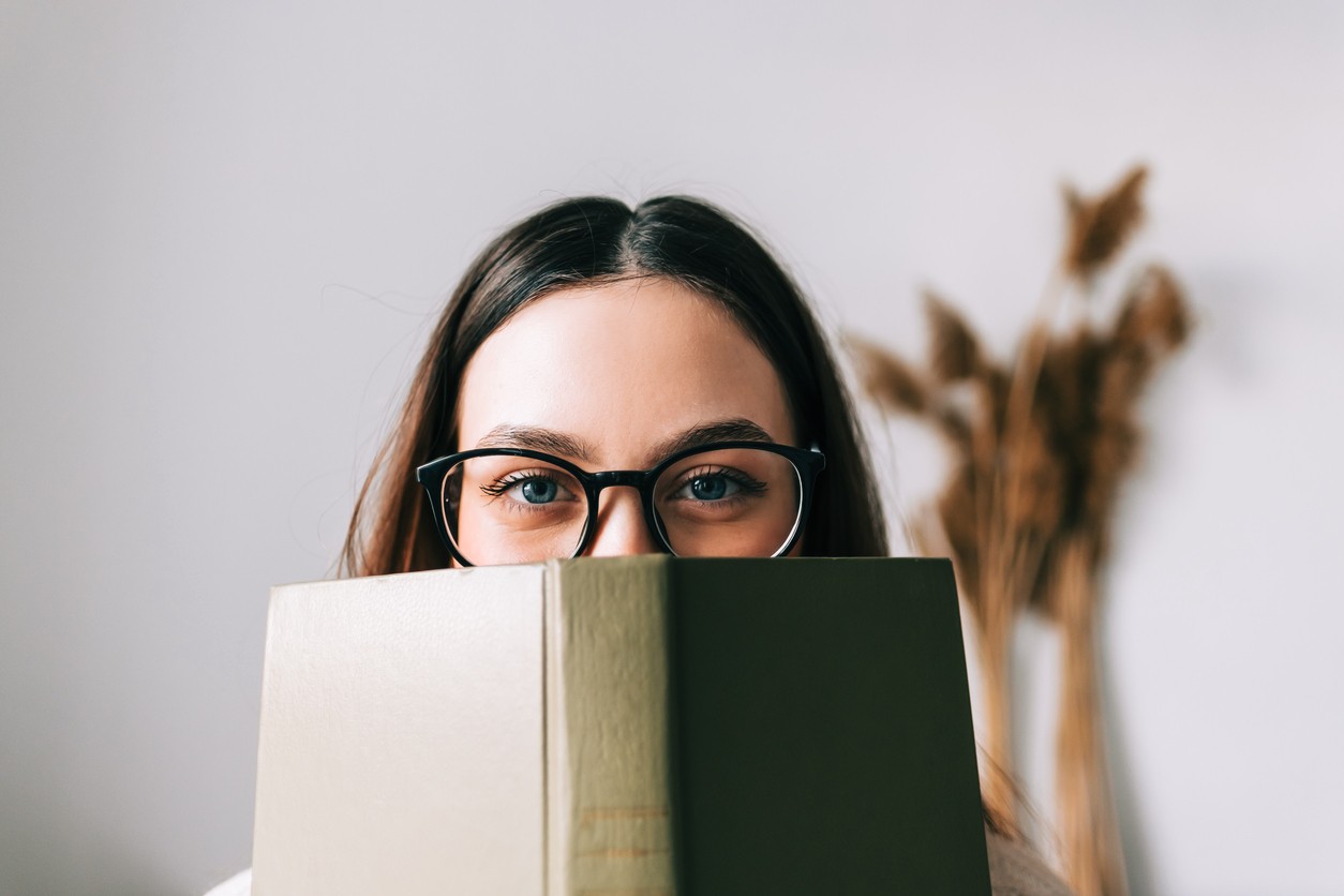 woman in glasses with book